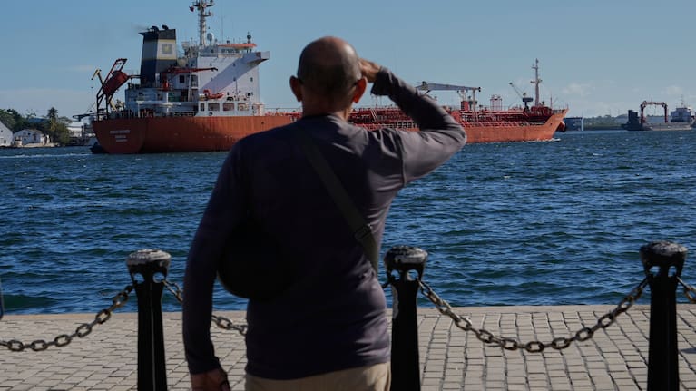 A person watches the oil tanker Ocean Mariner, Monrovia, arrive to the bay in Havana, Cuba