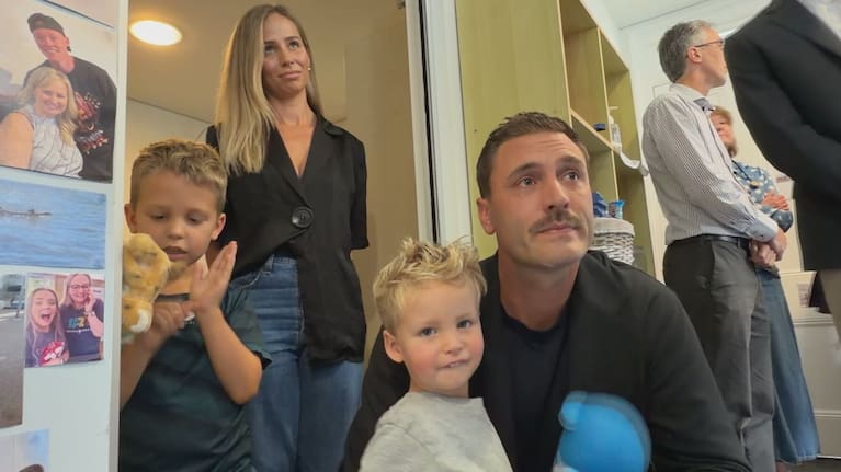 Luca Rooney, 2, centre, with his family.