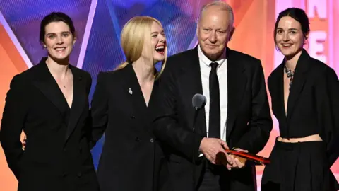 Getty Images Inga Ibsdotter Lilleaas, Elle Fanning, Stellan Skarsgård, and Renate Reinsve accept Best Intergen/Foreign for "Sentimental Value" onstage during the 2026 Annual Movies for Grownups Awards with AARP at Beverly Wilshire, A Four Seasons Hotel on January 10, 2026 in Beverly Hills, California.
