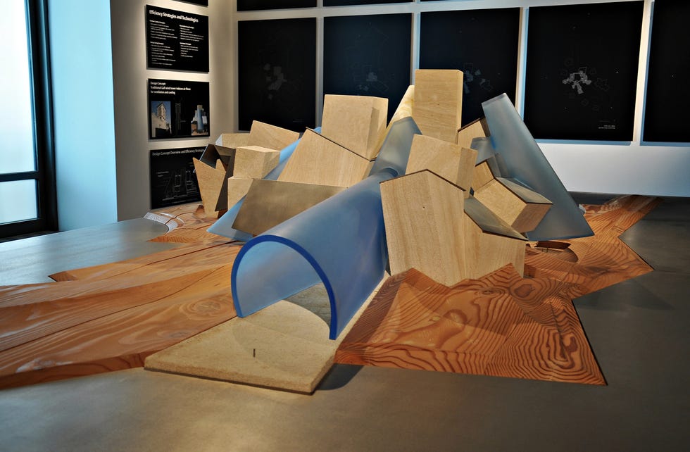 Architectural model featuring geometric shapes in a gallery setting. Architectural model featuring geometric shapes in a gallery setting.