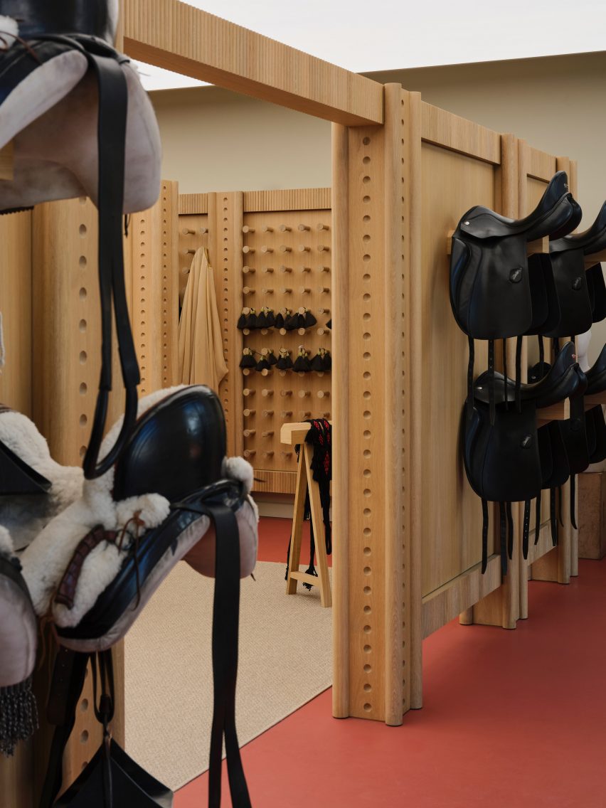 Saddles hung up on a wall