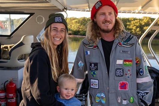 family of three on the boat