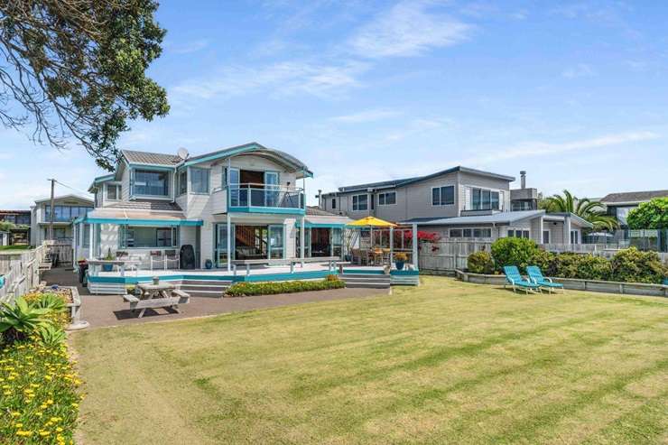 A five-bedroom home on the waterfront at Cooks Beach is on the market for sale. Photo / Supplied
