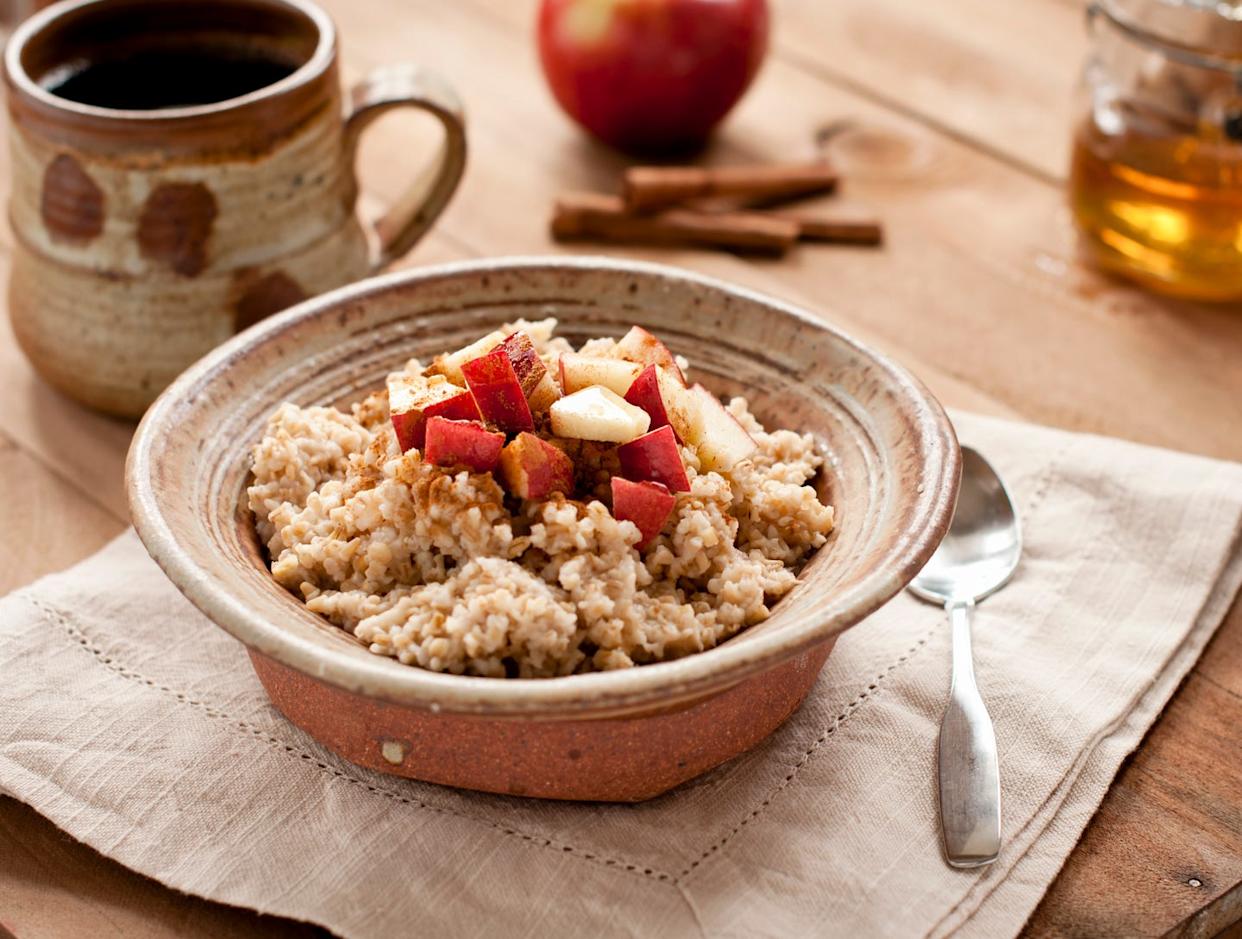 breakfast made of oatmeal with apples, honey and cinnamon