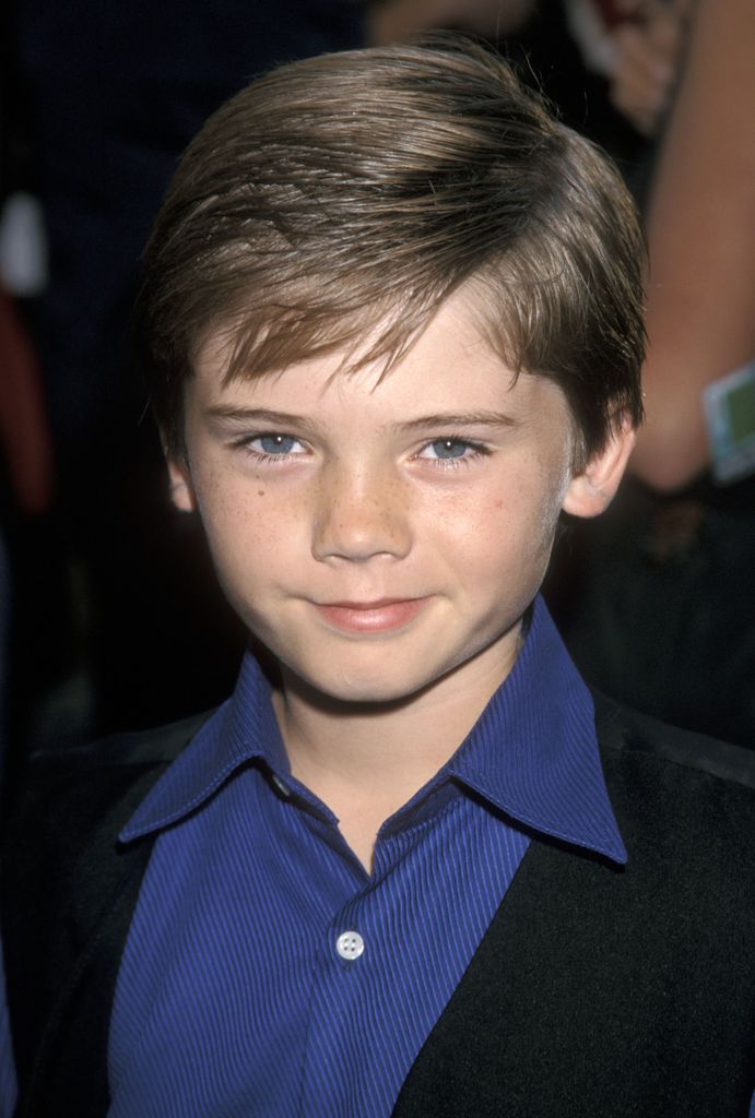 Jake Lloyd in a blue shirt as a child