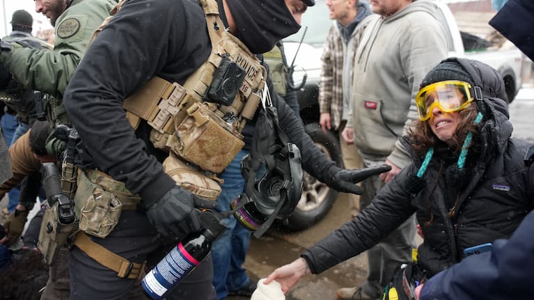 Federal agents detain a person in Minneapolis.