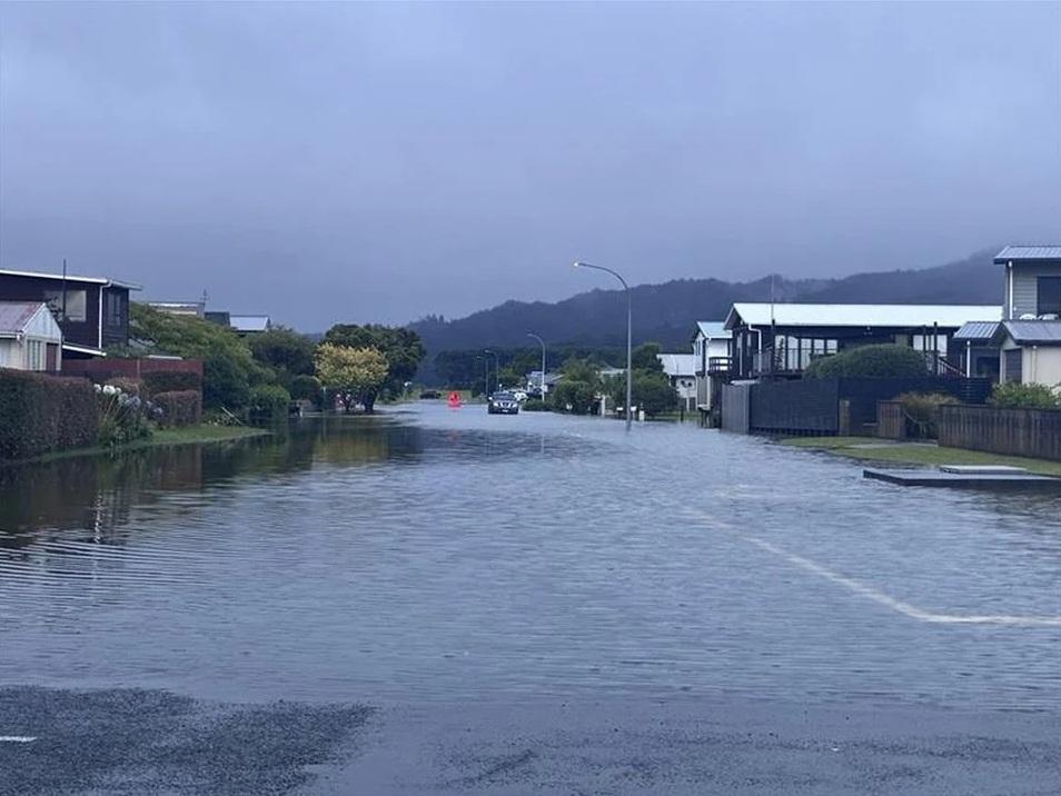 Two missing after slip in Tauranga as weather woes continue