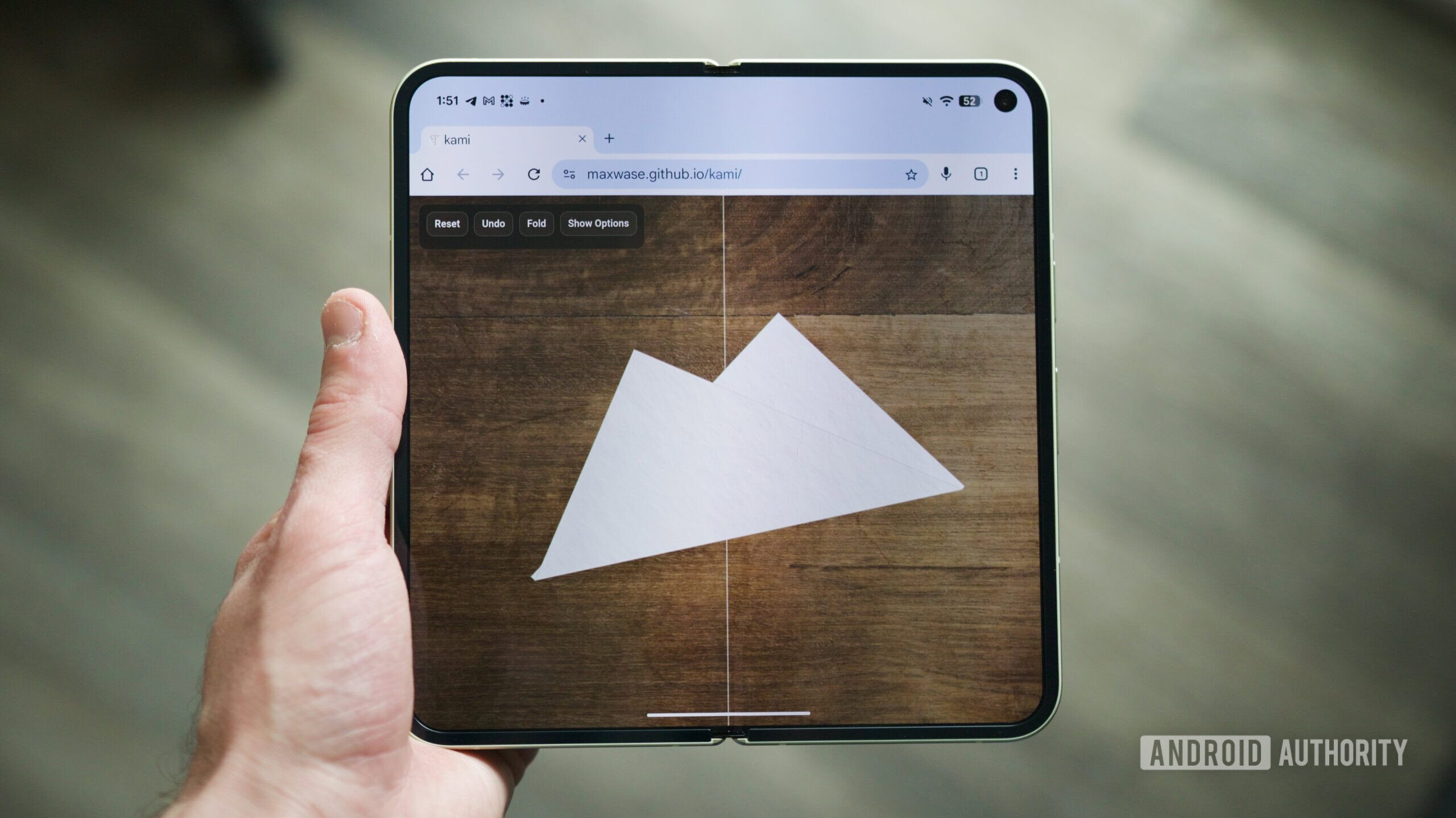 Origami website running on a foldable phone.