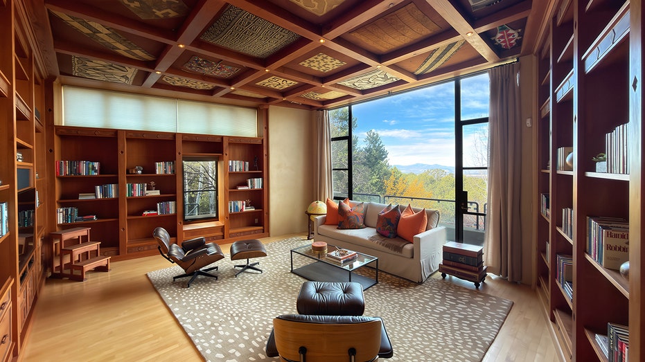 The home also features a library with a picturesque view.