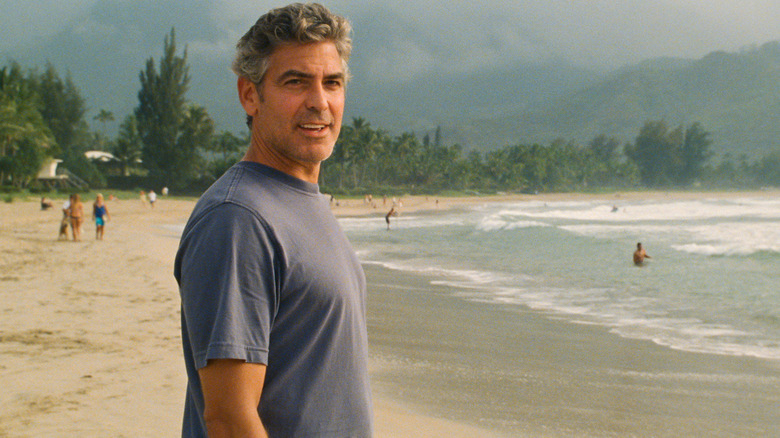 Matt King standing on a beach in The Descendants