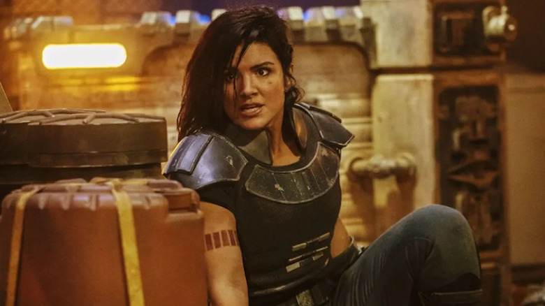 Gina Carano as Cara Dune crouching in The Mandalorian