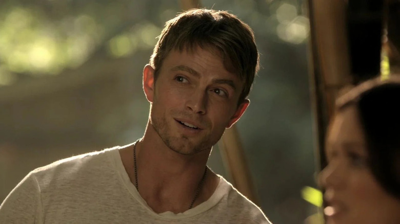 Wade Kinsella leans in smiling on Hart of Dixie