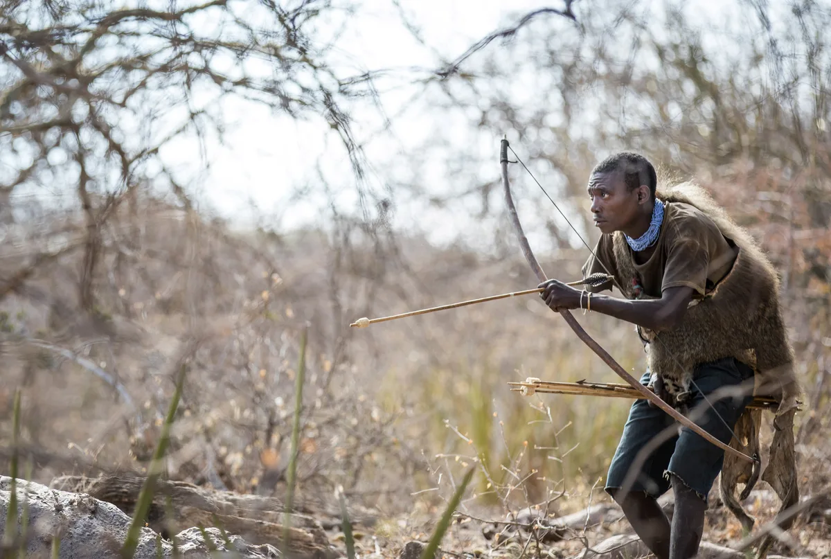 Hadzabe hunter with bow and arrow