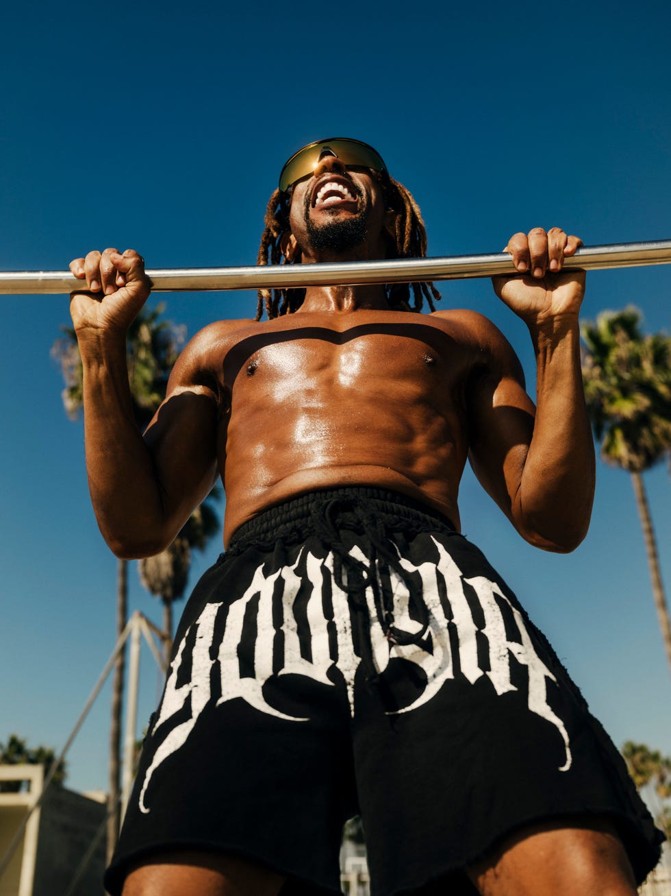 lil jon performing a pullup outdoors