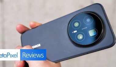 A hand holds a black HONOR smartphone, showcasing its large circular rear camera module. The image features a "PetaPixel Reviews" banner in the lower left corner.