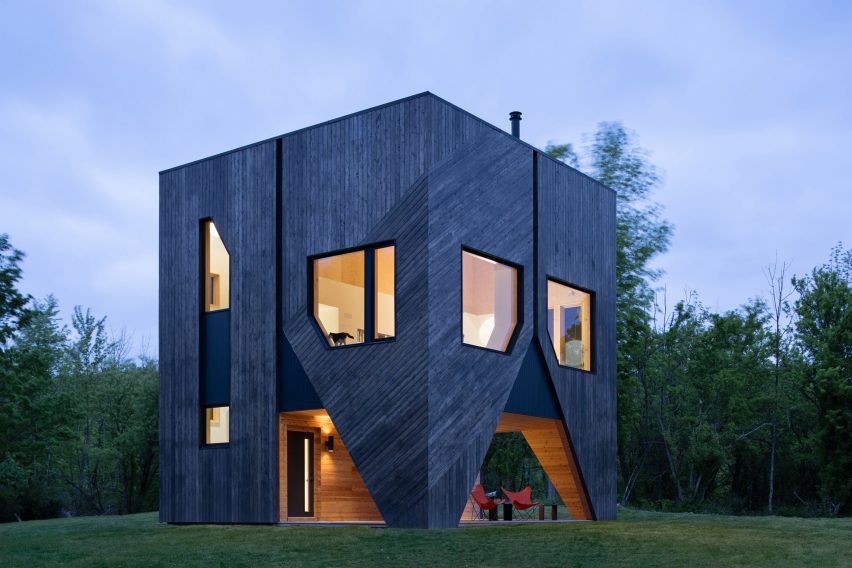 Cedar-clad house at night