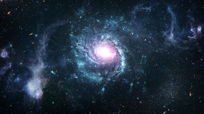 an image of outer space with stars, planets, and galaxies