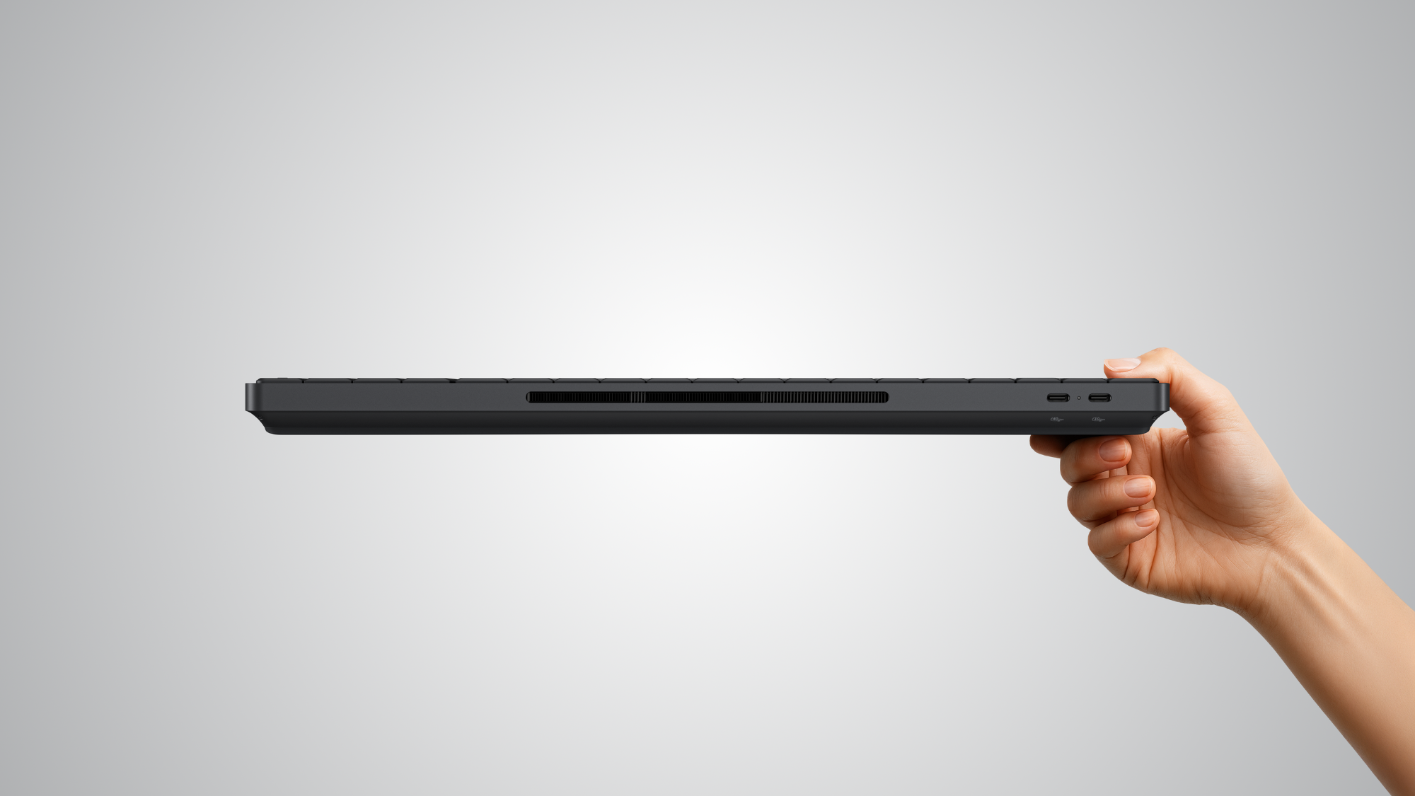 a person holding the hp eliteboard g1a with one hand