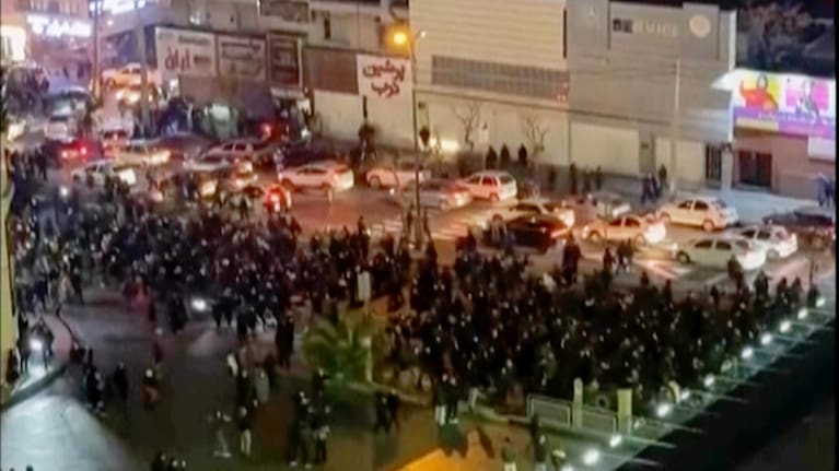 In this frame grab from video taken by an individual not employed by The Associated Press and obtained by the AP outside Iran shows people blocking an intersection during a protest in Tehran