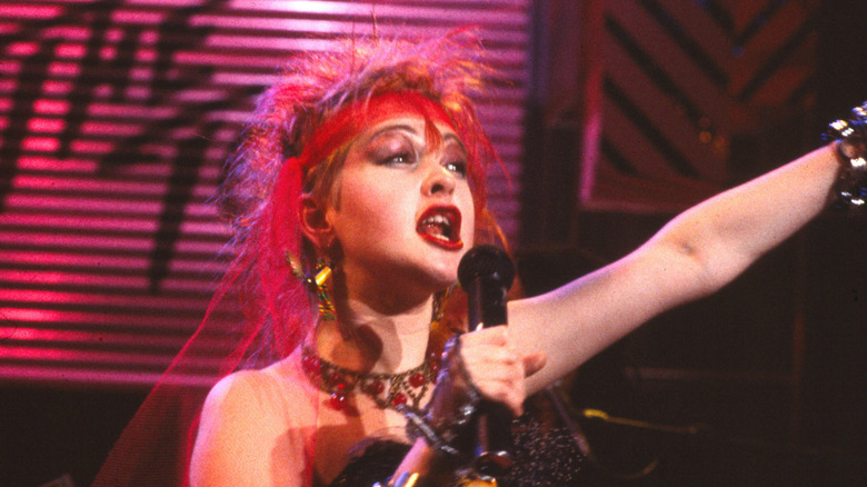 Cyndi Lauper singing onstage in the 1980s
