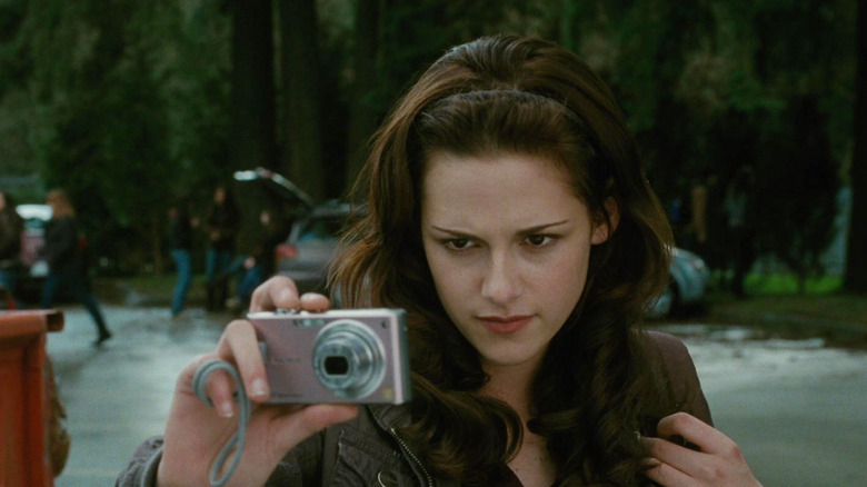 Bella holding a camera in The Twilight Saga: New Moon