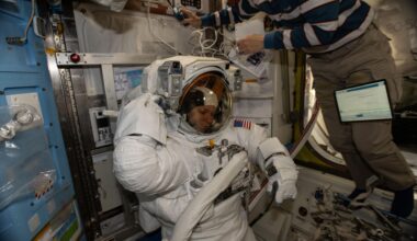 NASA astronaut and Expedition 74 Flight Engineer Zena Cardman is pictured in her pressurized spacesuit, checking its communication and power systems ahead of a spacewalk planned for Thursday, Jan. 8, 2025. At upper right, JAXA (Japan Aerospace Exploration Agency) astronaut and Flight Engineer Kimiya Yui assists Cardman as she tests the operations of her spacesuit inside the International Space Station’s Quest airlock.