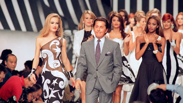 Italian fashion designer Valentino Garavani walks the catwalk with his models after a fashion show on October 20, 1991 in Paris