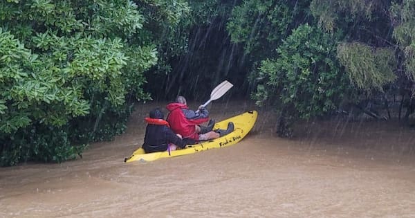 Women saved from floodwater at 'eye-level' in dramatic kayak rescue