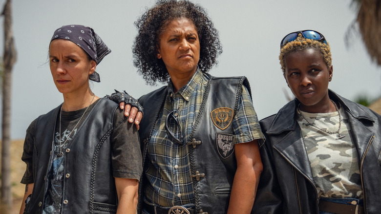 The Furies standing together in very cool leather jackets in 