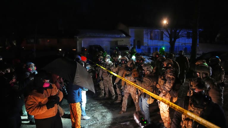 Law enforcement officers at the scene of a reported shooting Wednesday, January 14, 2026, in Minneapolis.