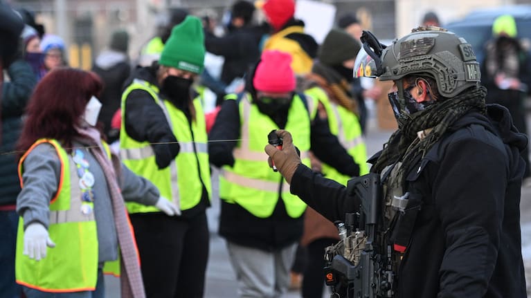 Law enforcement uses a chemical agent on protesters outside the Bishop Henry Whipple Federal Building,.