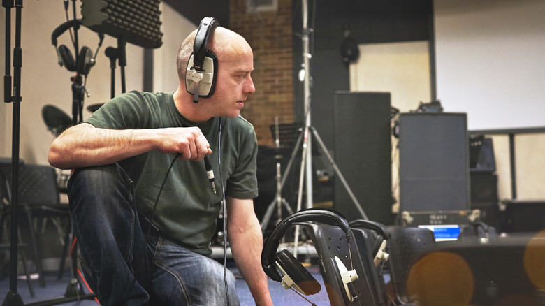 Listening to high quality audio through wired headphones in a studio