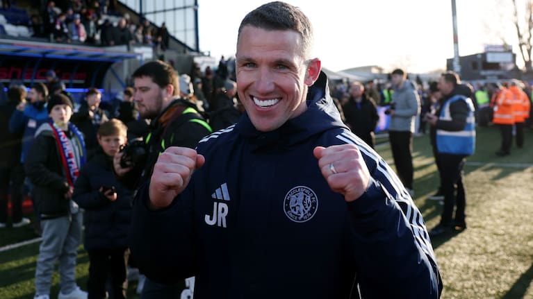 Macclesfield manager John Rooney celebrates his team's victory over Palace.