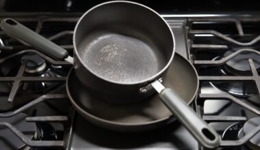 teflon coated pans stacked on stovetop