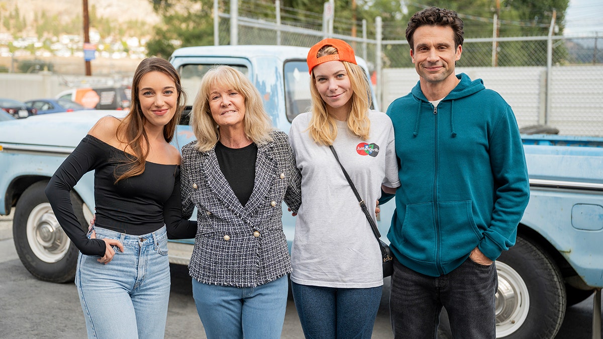 Mary Jo Buttafuoco posing with the cast of "I Am Mary Jo Buttafuoco."