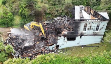 Residents return as smell of smoke lingers