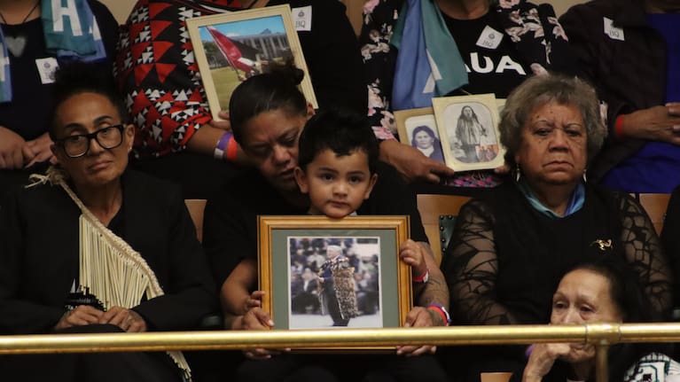 Ngāti Hāua iwi members witness the passing of their Treaty settlement into law.