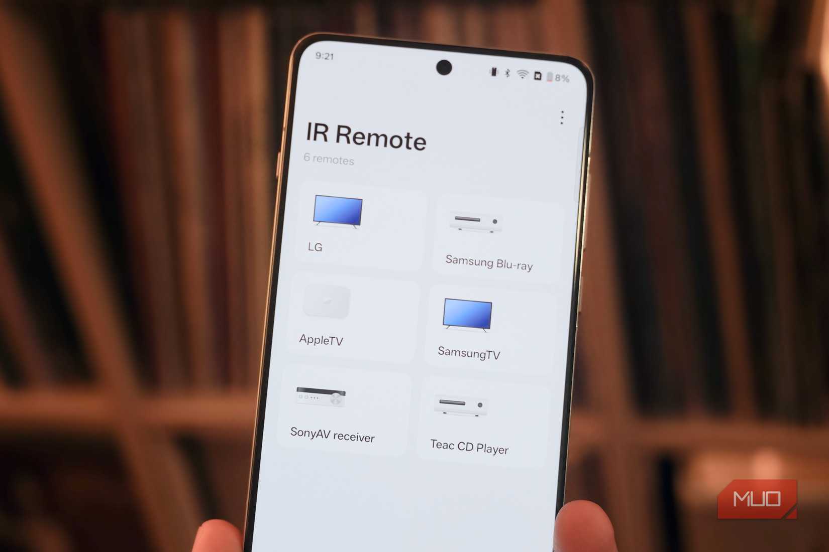 Controlling various devices in the OnePlus IR Remote app.