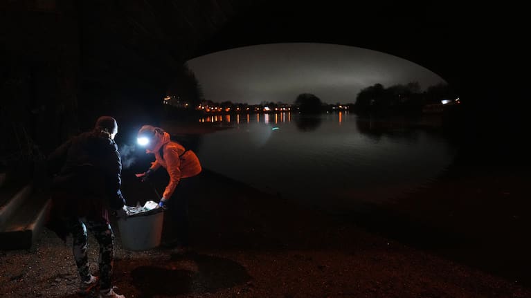 Participants in the Goodgym group collect litter from the riverbank to keep the River Thames free of plastic and other waste in London, Wednesday, January 14, 2026.