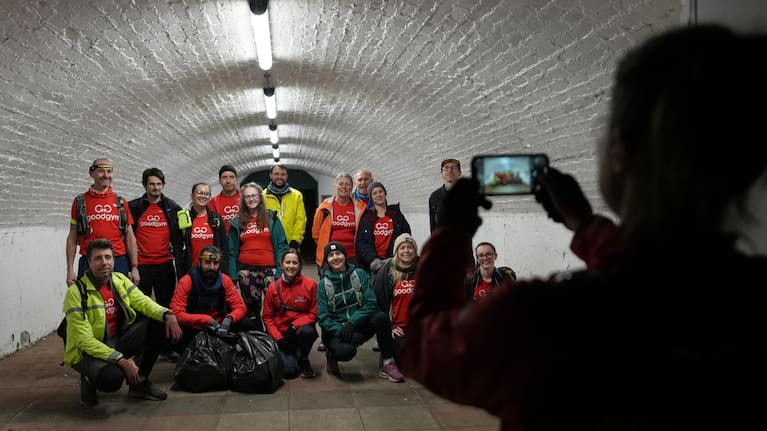 Participants in the Goodgym group pose for a group photograph after collecting litter to keep the River Thames free of plastic and other waste in London, Wednesday, January 14, 2026.