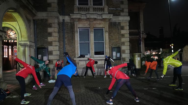 Participants in the Goodgym group warm up before running to collect litter to keep the River Thames free of plastic and other waste in London, Wednesday, January 14, 2026.