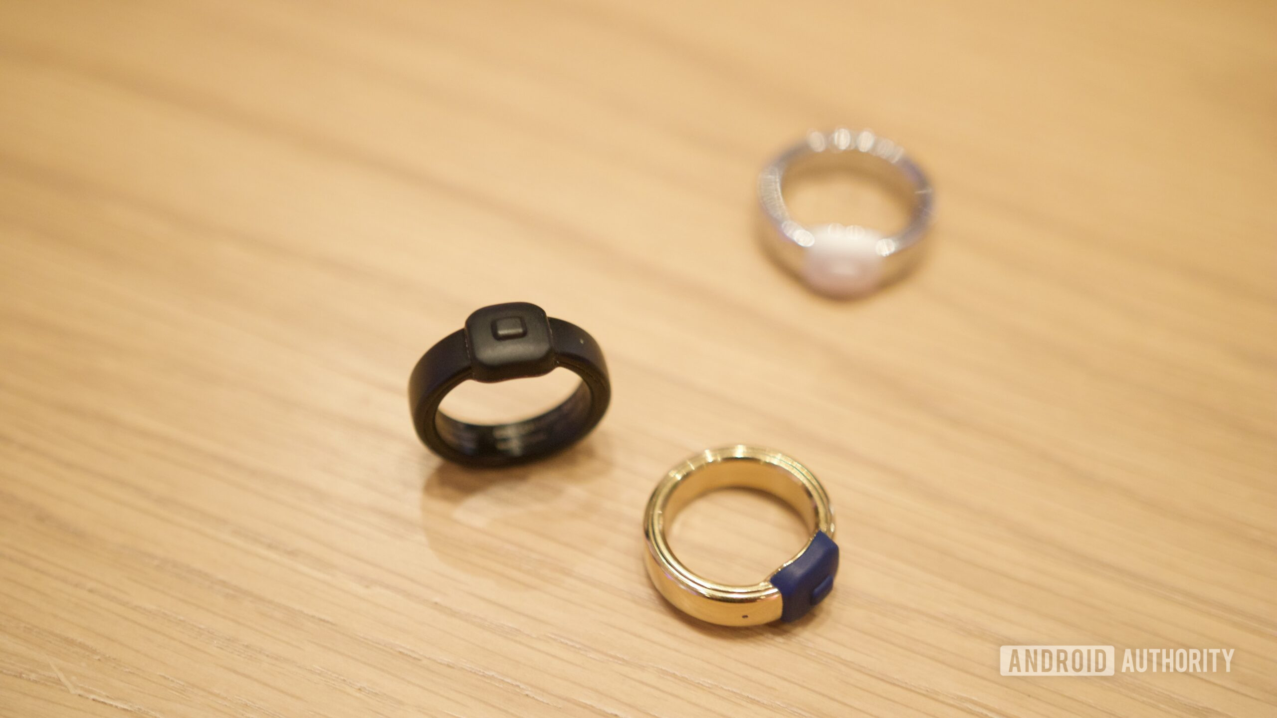 pebble index hands on ces 9 Pebble Index 01 rings on a table.