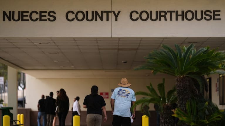 People ender the Nueces County Courthouse in Corpus Christi, Texas, as jury selection continues in the trial for former Uvalde school district police officer Adrian Gonzales.