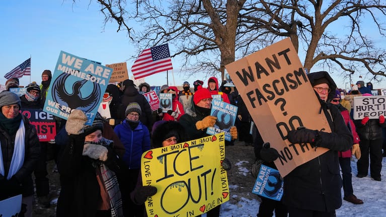 People gather for a protest outside the Bishop Henry Whipple Federal Building in Minneapolis.