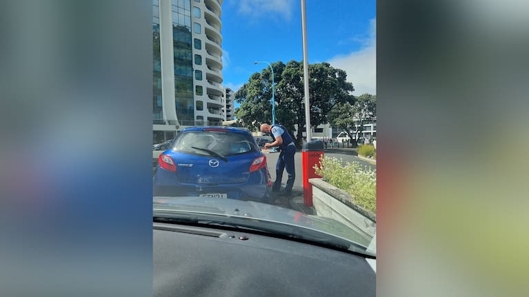 Mass exodus: Police take names as campers stream out of the grounds.