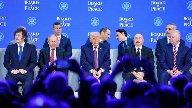 President Trump sits on the podium during a session on the Board of Peace initiative of US President Donald Trump at the Annual Meeting of the World Economic Forum.