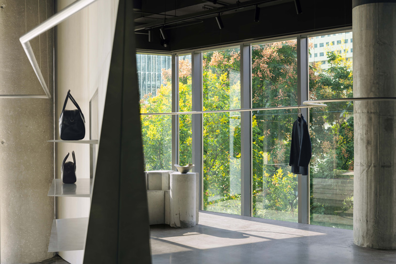 continuous steel rail traces shanghai showroom’s sculptural interior, like a freehand drawing