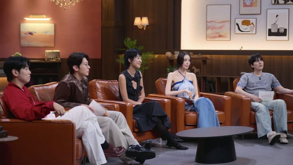 The Single's Inferno hosts watch the contestants in Season 5