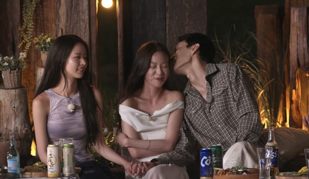Park Hee-sun and Kim Jae-jin while Jae-jin whispers to Lee Joo-young in Single's Inferno Season 5