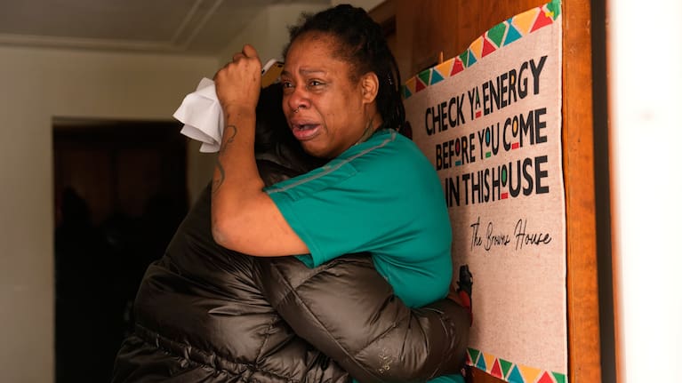 Teyana Gibson Brown, right, wife of Garrison Gibson, reacts after federal immigration officers arrested Garrison Gibson, Sunday, Jan. 11, 2026, in Minneapolis.